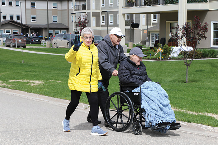 A couple from Redvers on the walk pushing a relative who lives in Cobblestone House.<br />
